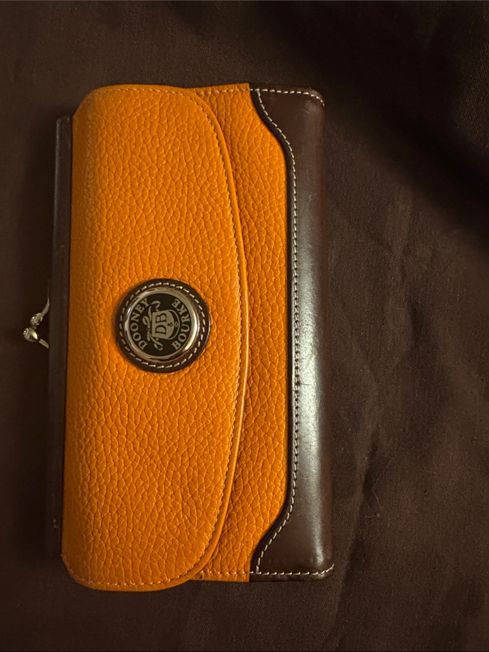 Dooney & Bourke Orange and Brown Pebbled Leather Wallet with Logo Plaque